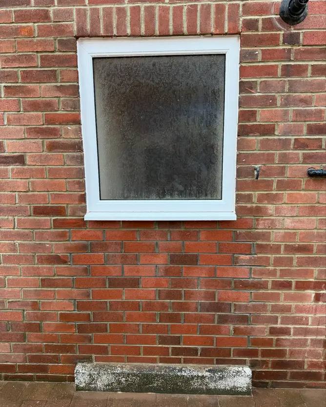 Neat brick infill beneath a window by G&M Building Solutions